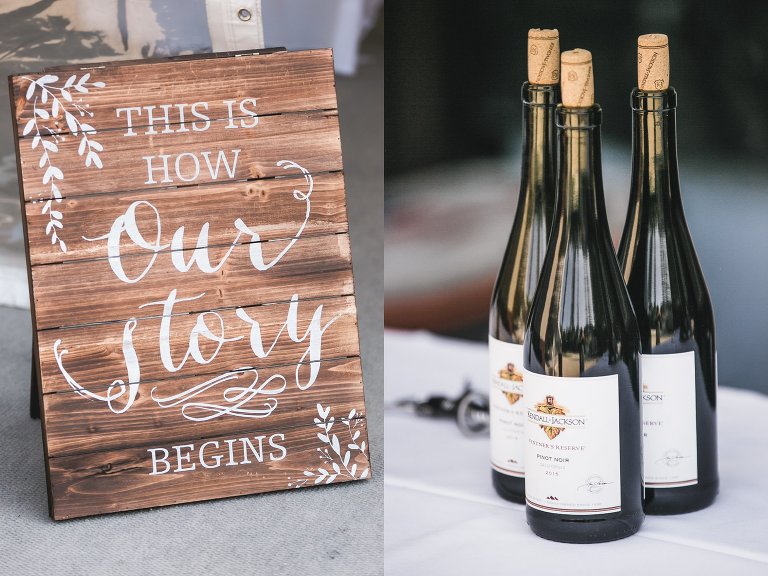 Wooden sign and wine bottle details at wedding reception