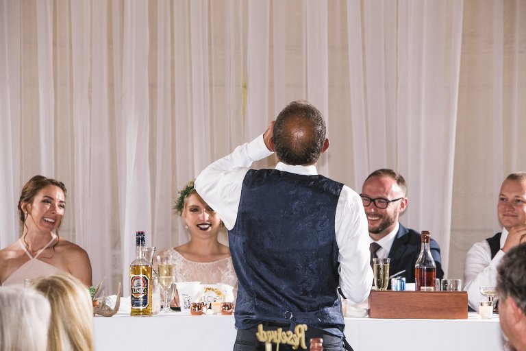 Bride and groom taking a shot