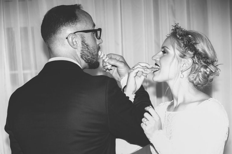 Bride and groom feeding each other krasenkake