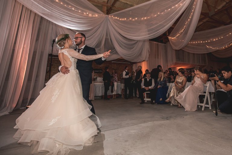 Zach and Coty's first dance in barn venue
