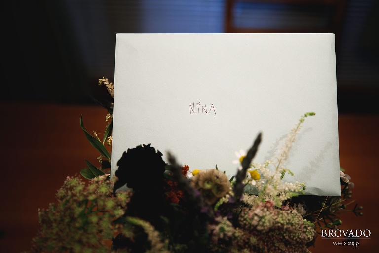 Handwritten card and bouquet from Karen to bride Nina