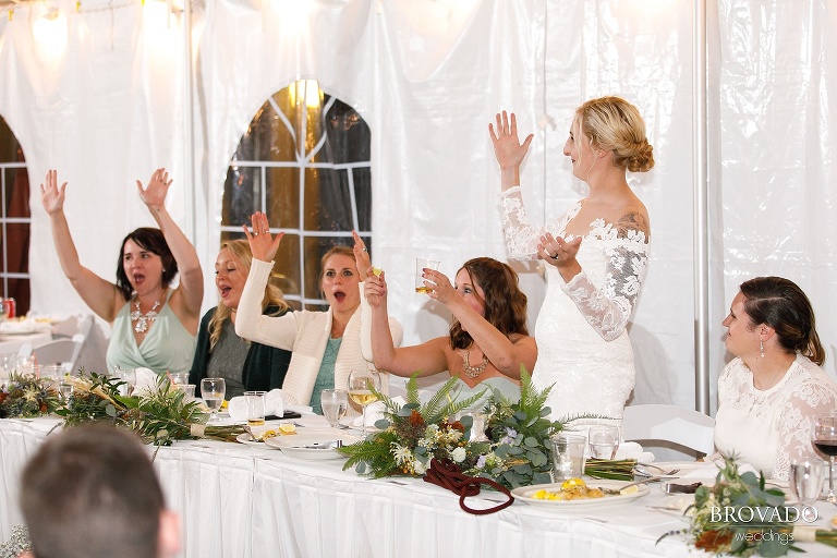 Wedding party cheering at reception