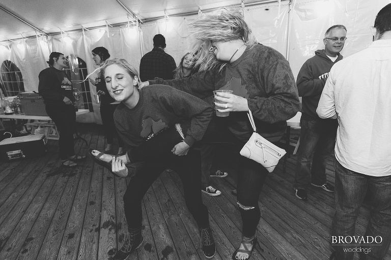 Nina using her friend's leg as an air guitar