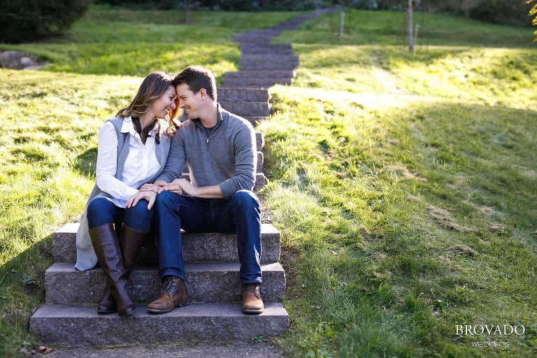 Hannah and Jason sitting on the steps in blue jeans