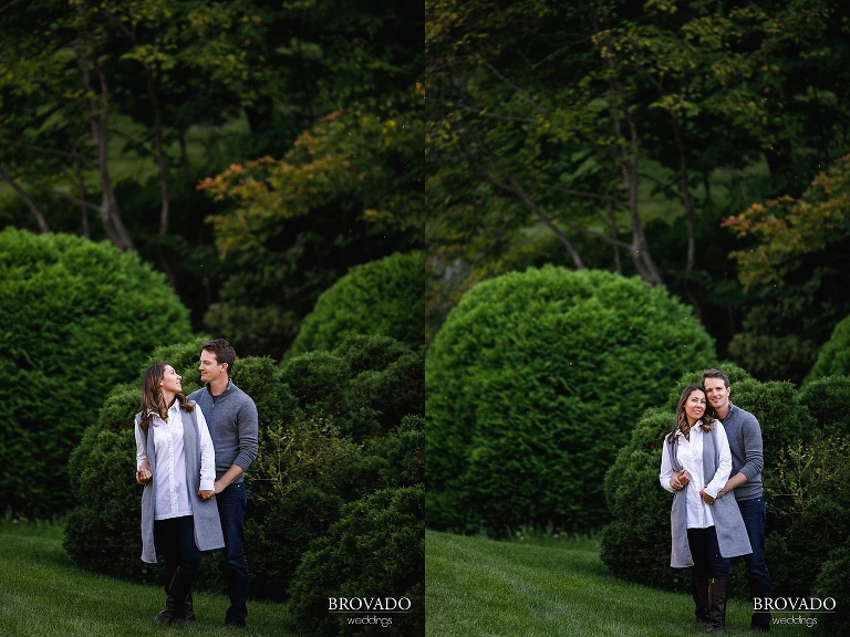 Hannah and Jason in front of round shrubs