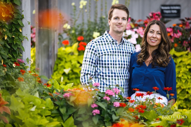 Hannah and Jason posing among flowers