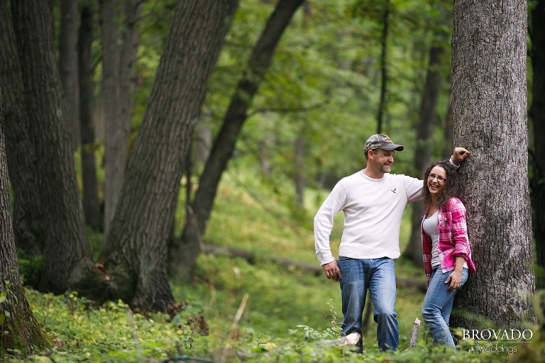 Kelly and Robert leaning against a tree on their property