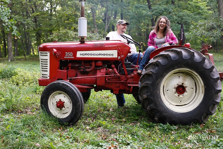 Kelly and Robert laughing on their tractor