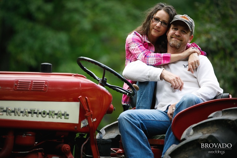 Kelly and Robert posing with their red tractor