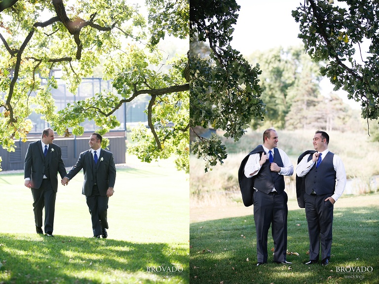 Grooms holding hands outside of  Wayzata Country Club