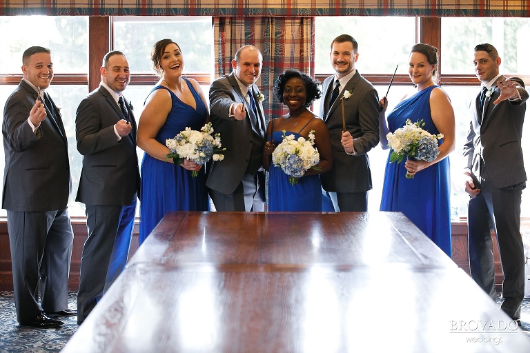 Zach posing with wedding party and wands