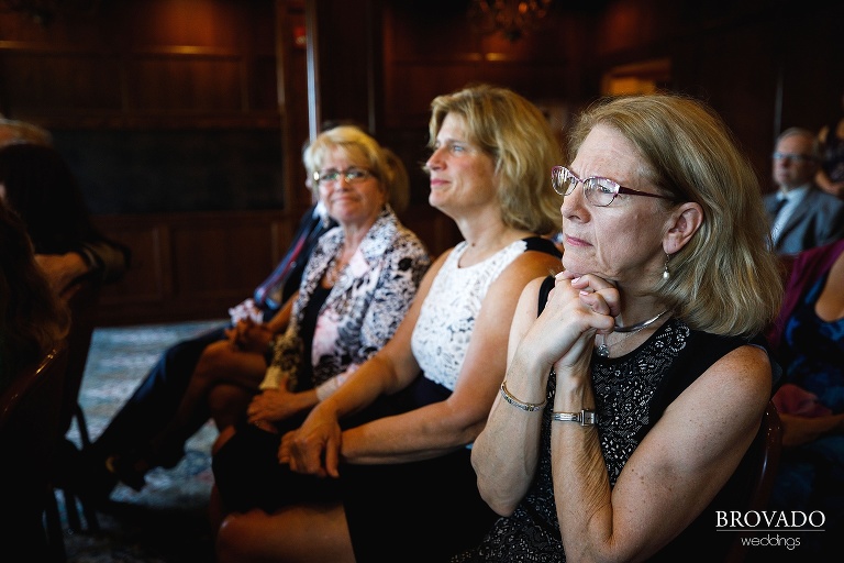 Wedding guest watching ceremony