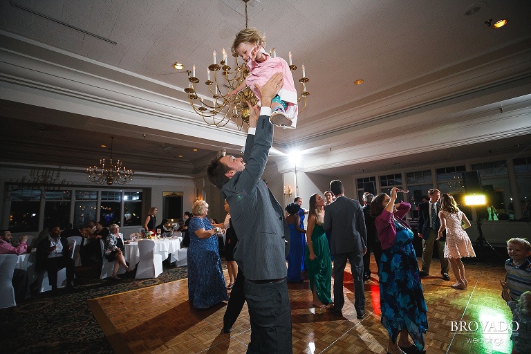 Wedding guest dancing with his daughter