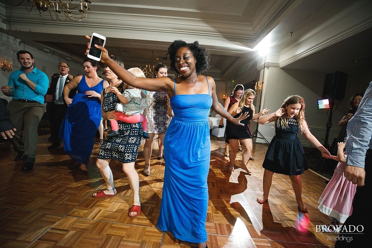 Groomsmaid dancing at wedding