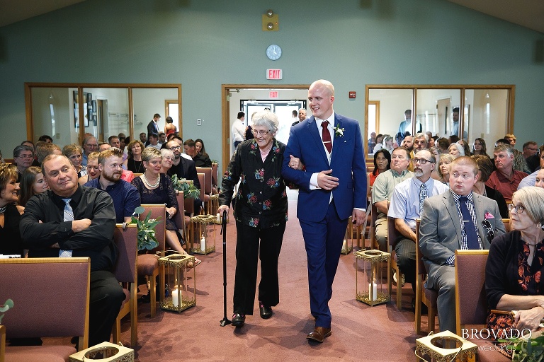 Derek walking his grandmother down the aisle