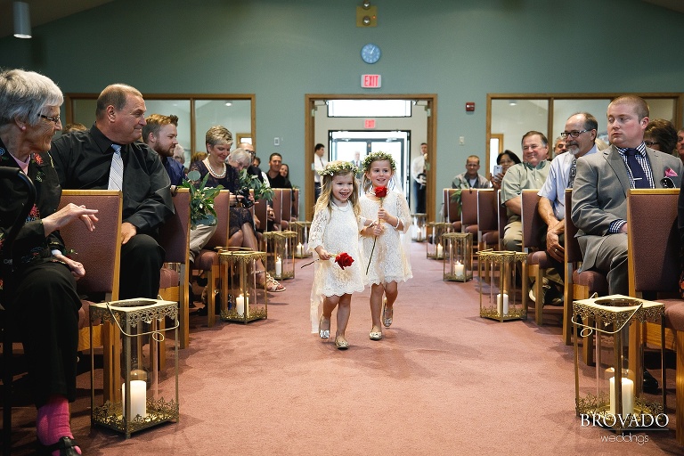 Flower girls walking down the aisle
