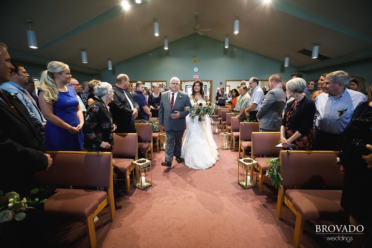 Brenna's father walking her down the aisle