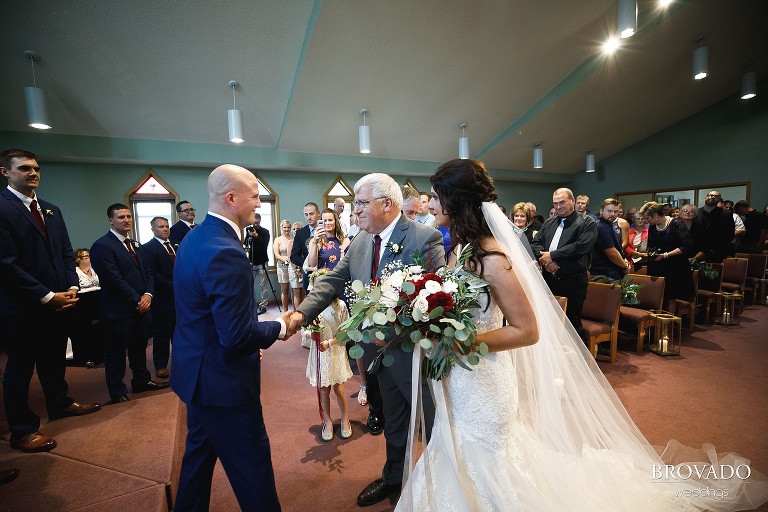 Brenna's father shaking Derek's hand