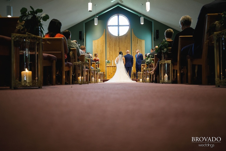 Brenna and Derek standing at the front of Epihpany Lutheran Church 