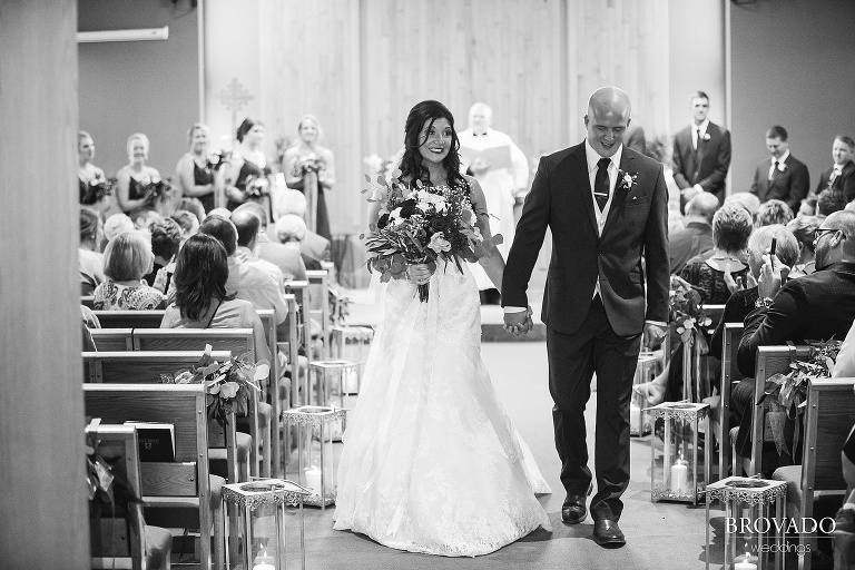 Brenna and Derek walking out of their wedding ceremony