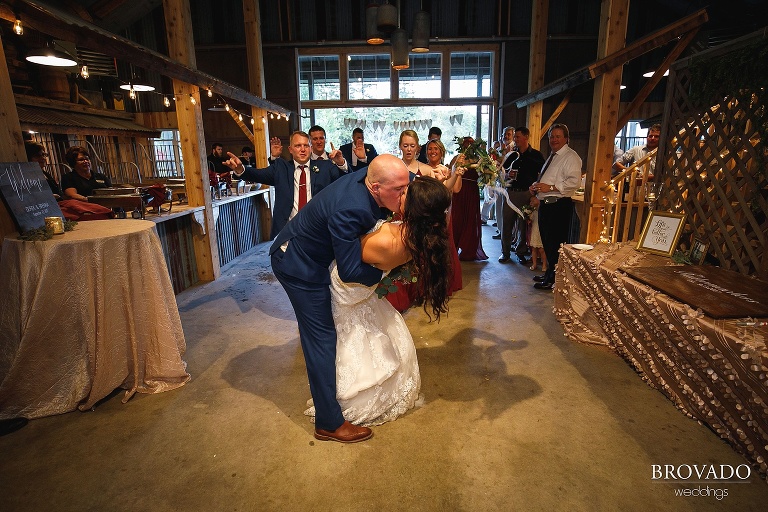 Brenna and Derek kissing during grand entrance