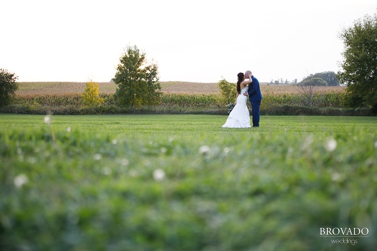 Wide angle kissing sunset pose