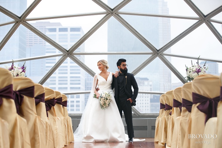 Ajit and Jenna posing in the Millenium Hotel's glass dome