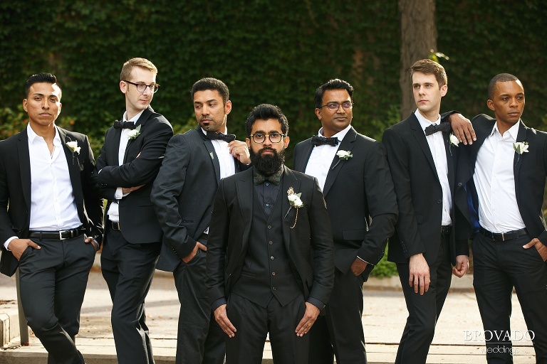 Serious groomsmen pose