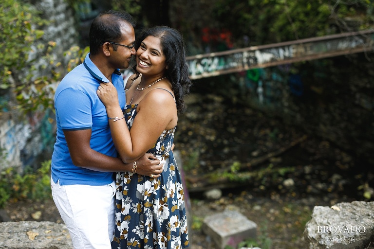 Roshni and Dharmik in front of downtown Minneapolis graffiti