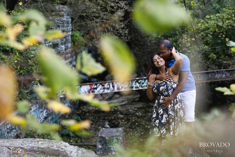 Roshni and Dharmik posing in front of minneapolis graffiti 