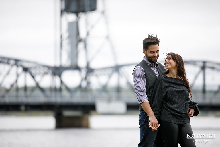 Yevgenia and Eugene laughing in front of stillwater lift bridge