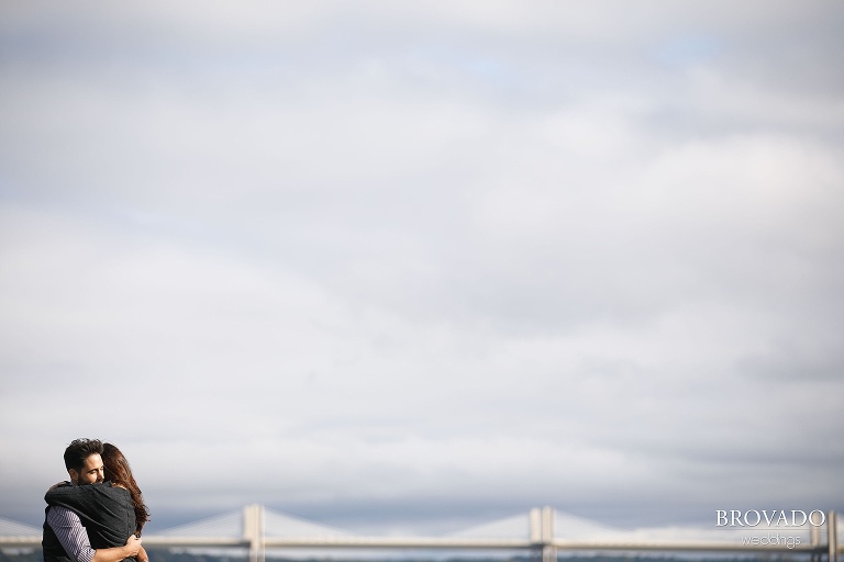Yevgenia and Eugene hugging in front of st croix river