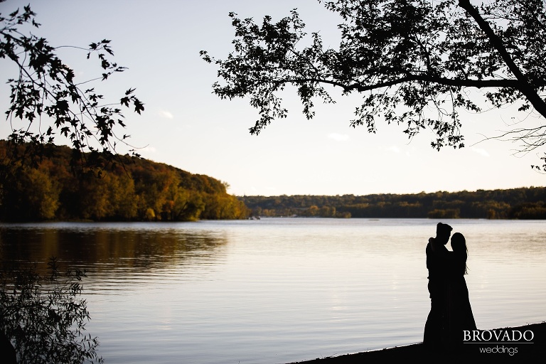 Silhouette of Yevgenia and Eugene in front of St Croix river
