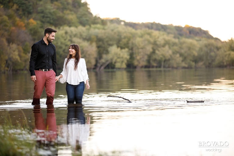 Yevgenia and Eugene walking through the st croix river