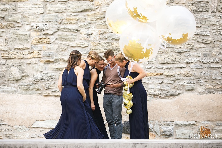 Videographer showing bridesmaids first look footage