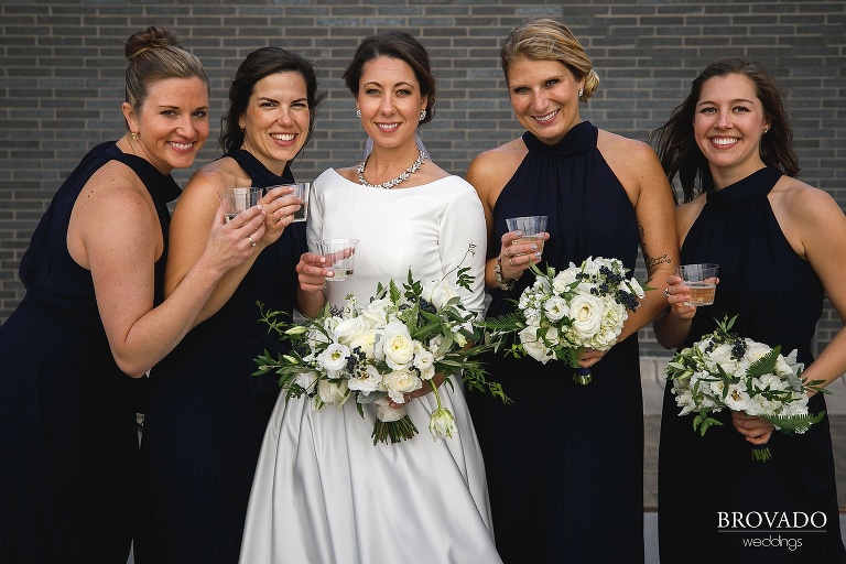 Hannah and her bridesmaids drinking champagne