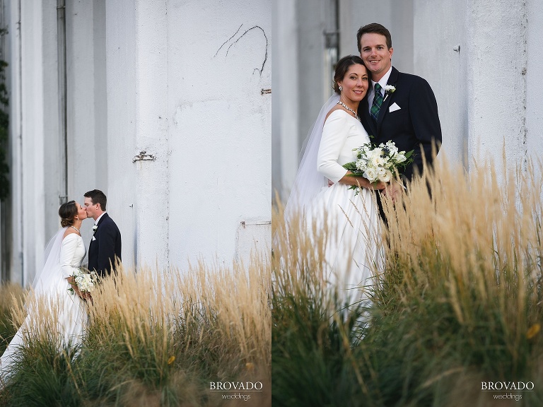 Newlyweds kissing outside of machine shop in northeast minneapolis
