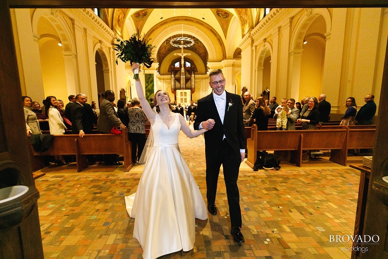 Megan and Ben cheering on their way out of st thomas chapel