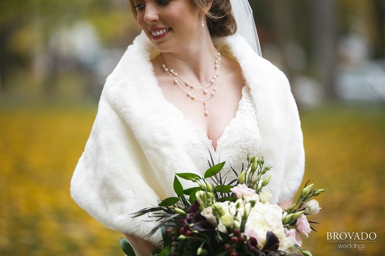 Detail of Megan's bouquet and pearl necklace
