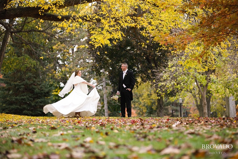 Megan twirling in her wedding dress on st thomas lawn