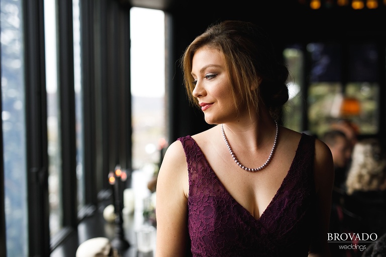 Portrait of bridesmaid in purple lace dress