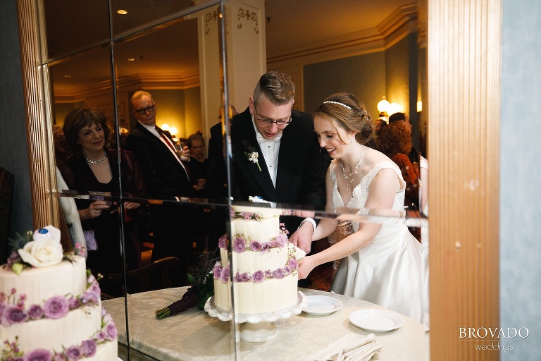 Megan and Ben cutting their cake