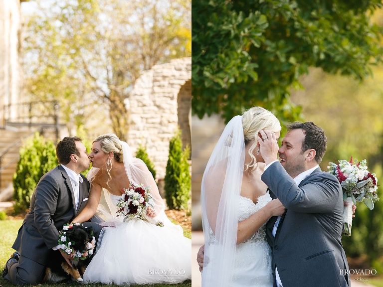 Rachel and Joe posing with their dog in a flower wreath
