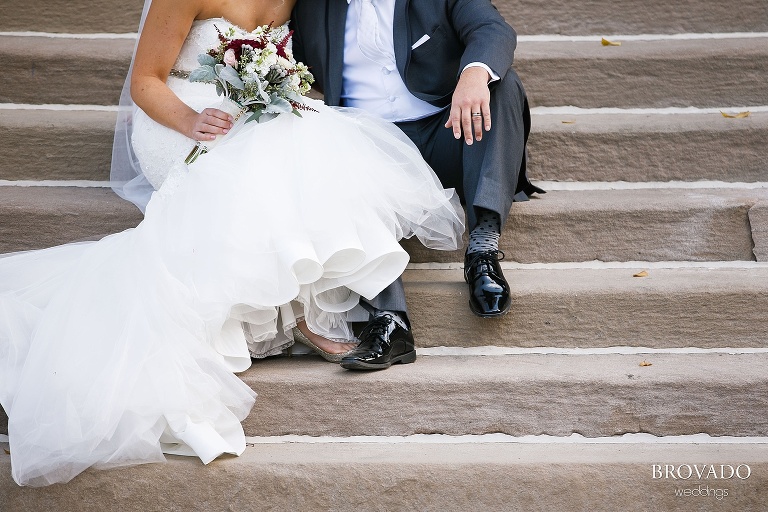 Detail of Rachel and Joe's wedding shoes on church steps