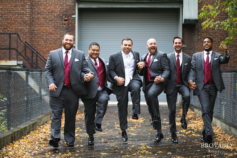 Joe and his wedding party skipping towards the camera