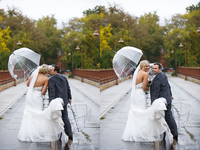 Rachel and Joe's standing under clear umbrellas in the Minneapolis rain