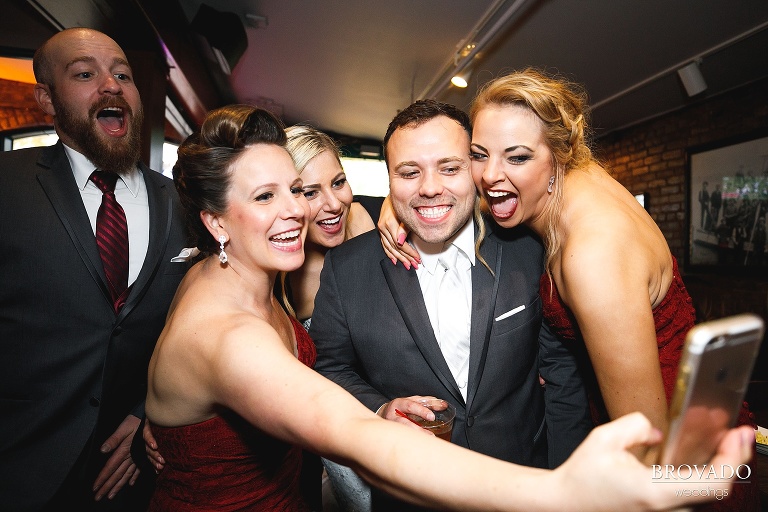 Joe and the bridesmaids taking a goofy photo together