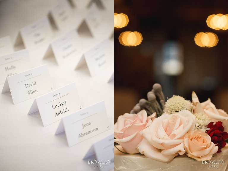 Detail of namecards and flowers on wedding cake