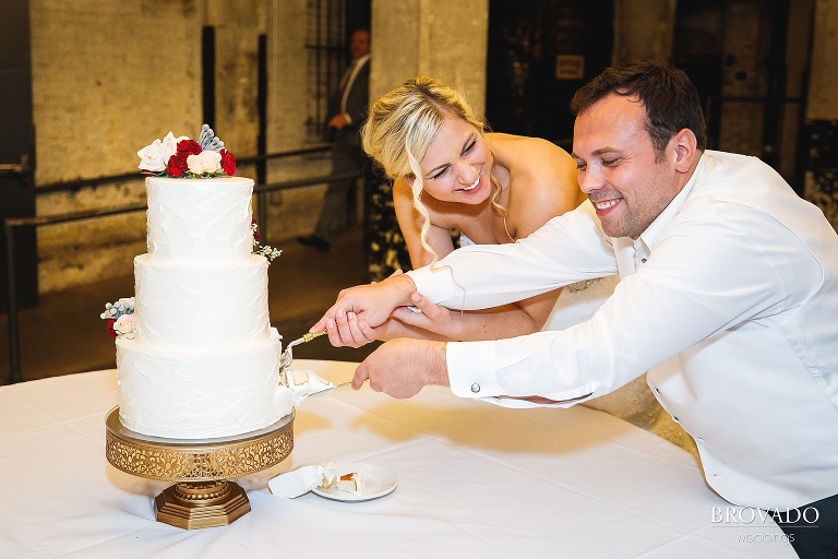 Rachel and Joe making a mess while cutting the cake