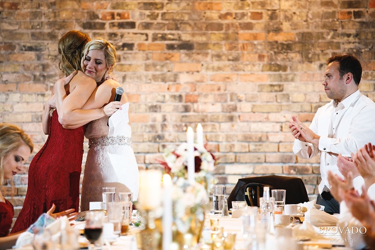 Rachel hugging her bridesmaid after a speech